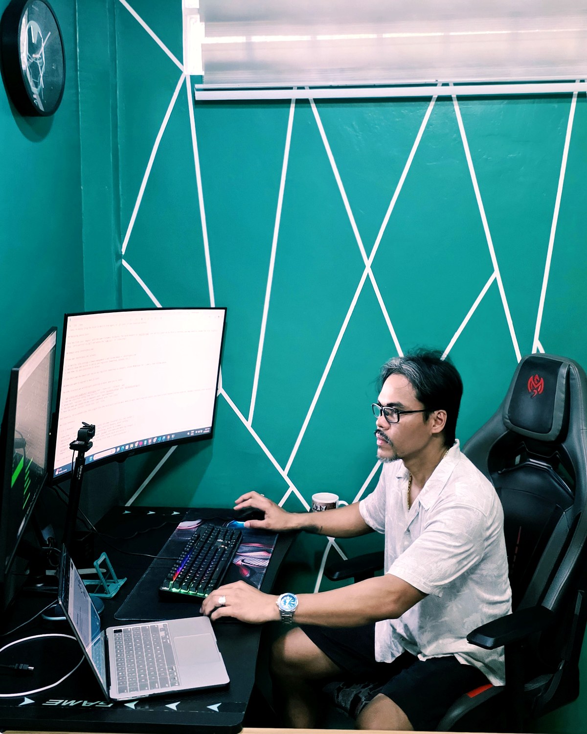 Jerry Bag-ao, founder of DeskForgeAI, at his desk in Tagbilaran City, Bohol